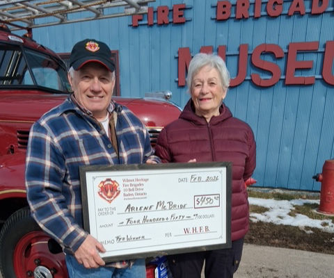 Wilmot Heritage Fire Brigades president Peter Gingerich presents February draw winner Arlene McBride with a cheque for $450 in last month’s fundraising draw. Photo courtesy of Wilmot Heritage Fire Brigades