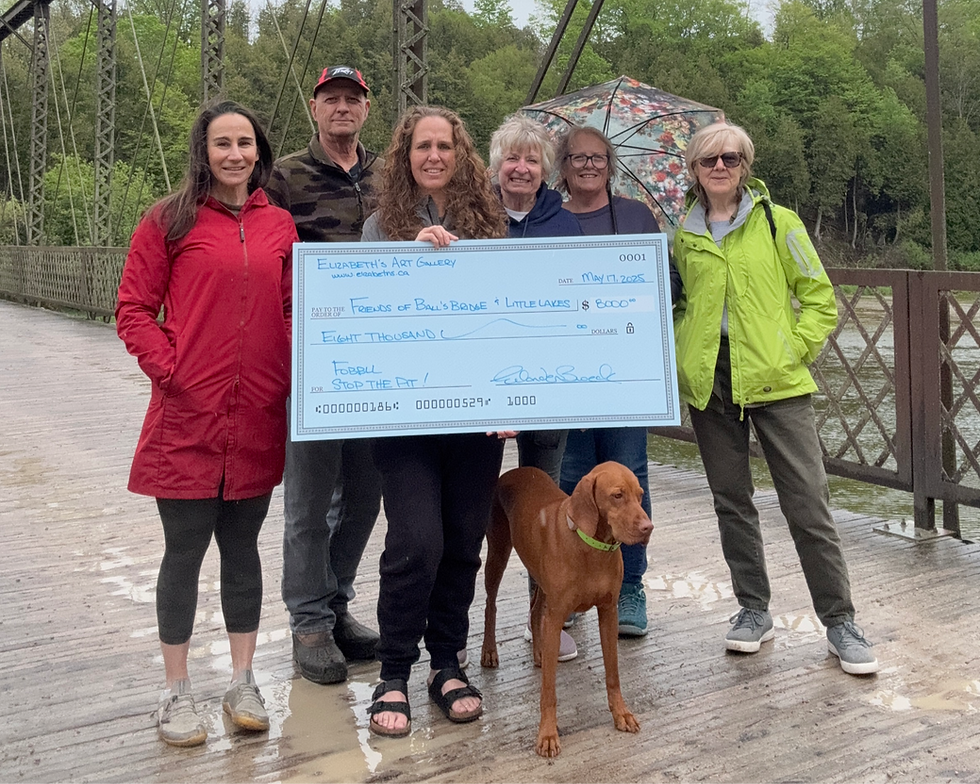 FOBBLL recently received a generous donation of $8,000. Pictured are Jennifer Morris, Al Meloche, Elizabeth Van den Broeck, Debbie Gillespie, Kathy Young, Rebecca Garrett and Athena the Vizsla.
