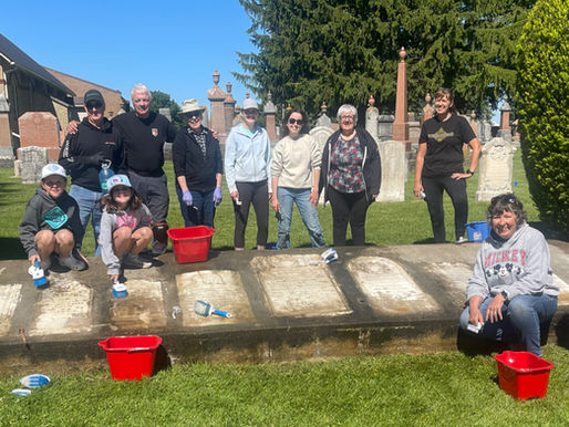 Trinity Lutheran Church volunteers restore historic cemetery monuments