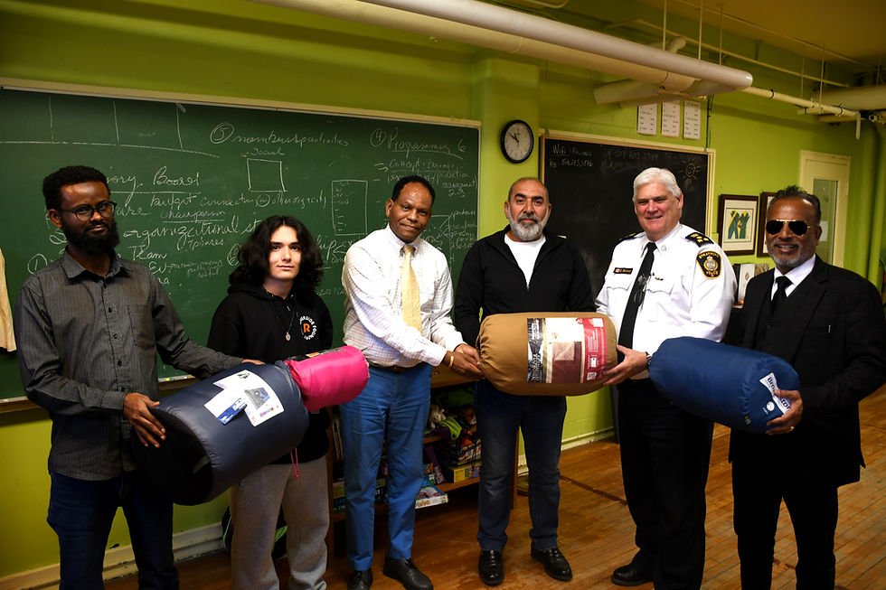The Multicultural Association of Perth Huron recently announced it will be collecting and distributing sleeping bags and blankets to unhoused residents of Stratford and St. Marys this winter. Pictured from left are association volunteer Jama Salat, co-op student Emre Koch, executive director Geza Wordofa, volunteer Mohammad Zoba, Stratford Police Chief Greg Skinner and volunteer Hira Dhariwal.