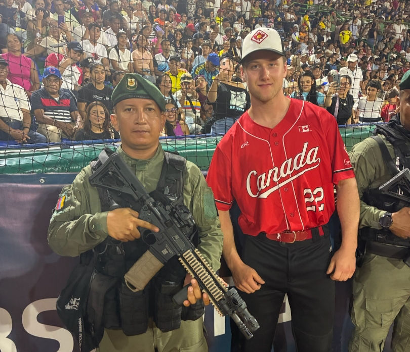 Tavistock’s Will Schlotzhauer, No. 22, competes at the World Fastball Championships in Colombia. Large crowds and a strong security presence, including armed personnel, were a common sight at the international event. Contributed photo