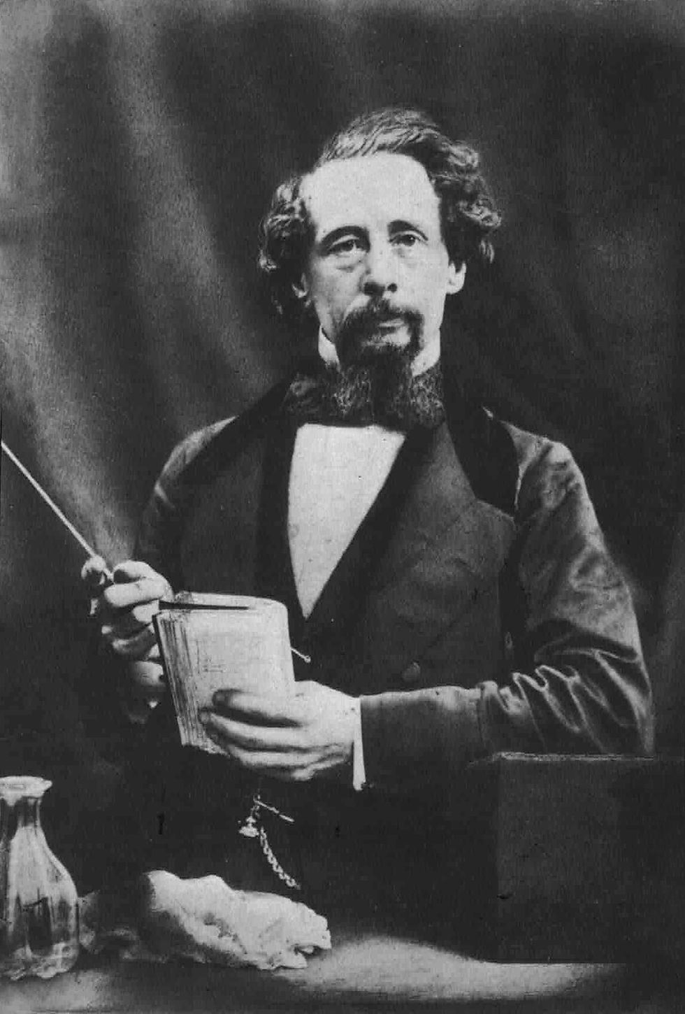 Charles Dickens at a reading of A Christmas Carol.