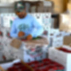man packing farm box.JPG