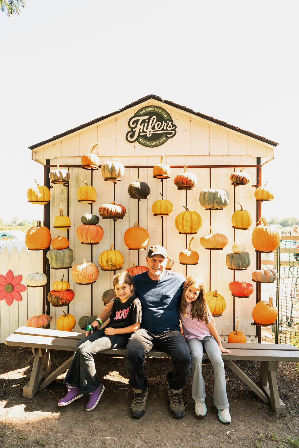 family in front of pumpkin wall_edited.jpg