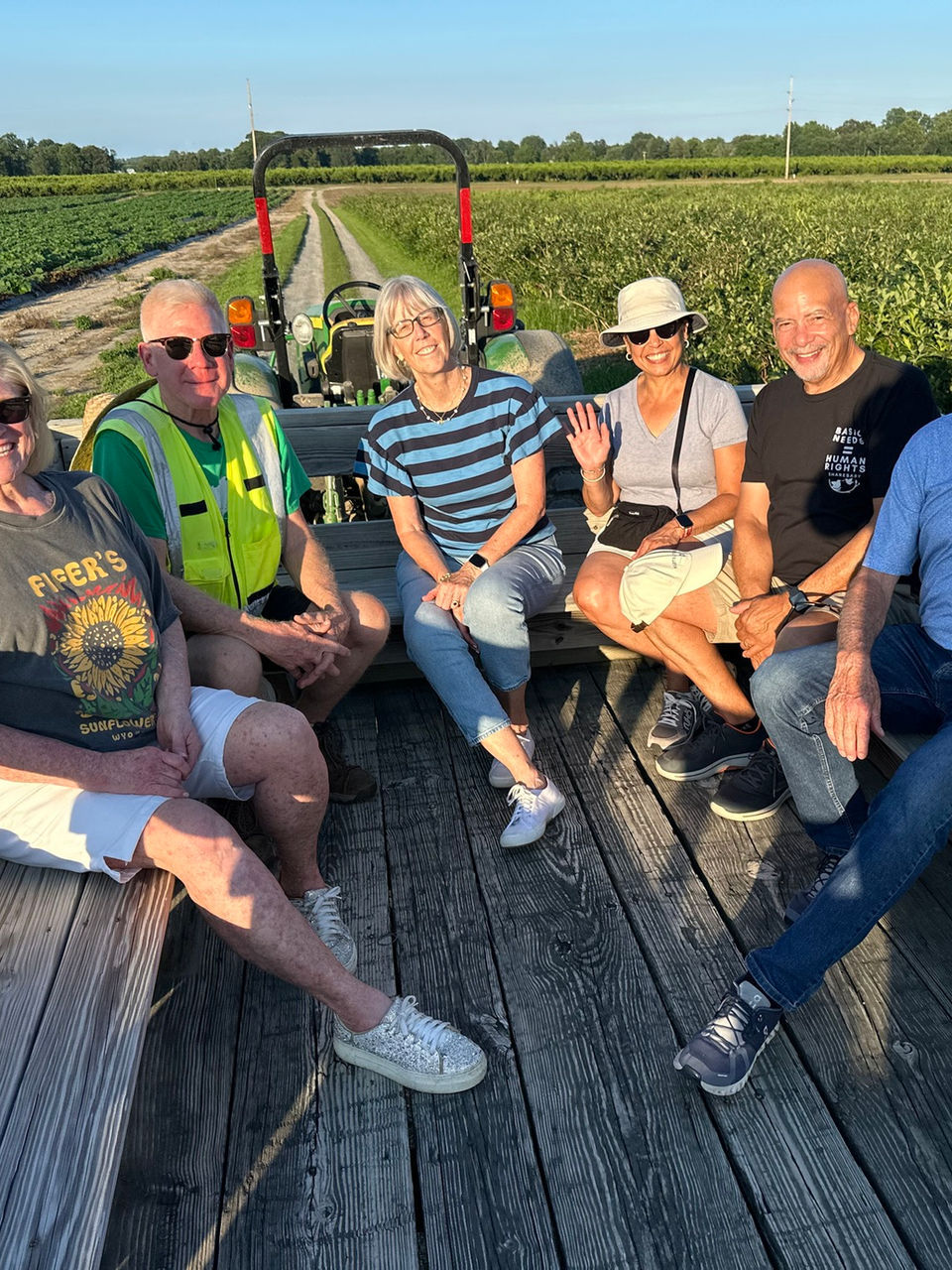 people sitting on fifer's tractor