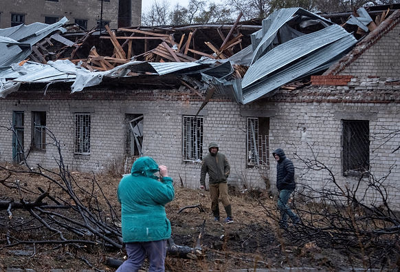 Residents walk at a site of a Russian missile strike, amid Russia's attack on Ukraine, in Dnipro, Ukraine November 21, 2024. Mykola Synelnykov/File Photo