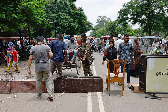 A member of the army blocks a road to restrict people's movement at the entrance of the Ganabhaban, the Bangladeshi prime minister's residence, a day after the resignation of Prime Minister Sheikh Hasina, in Dhaka, Bangladesh, August 6, 2024. /Mohammad Ponir Hossain