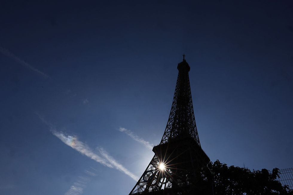 Paris 2024 Olympics - Paris, France - July 28, 2024 Sunlight shines through the Olympic Rings on the Eiffel Tower during the Olympics /Kai Pfaffenbach