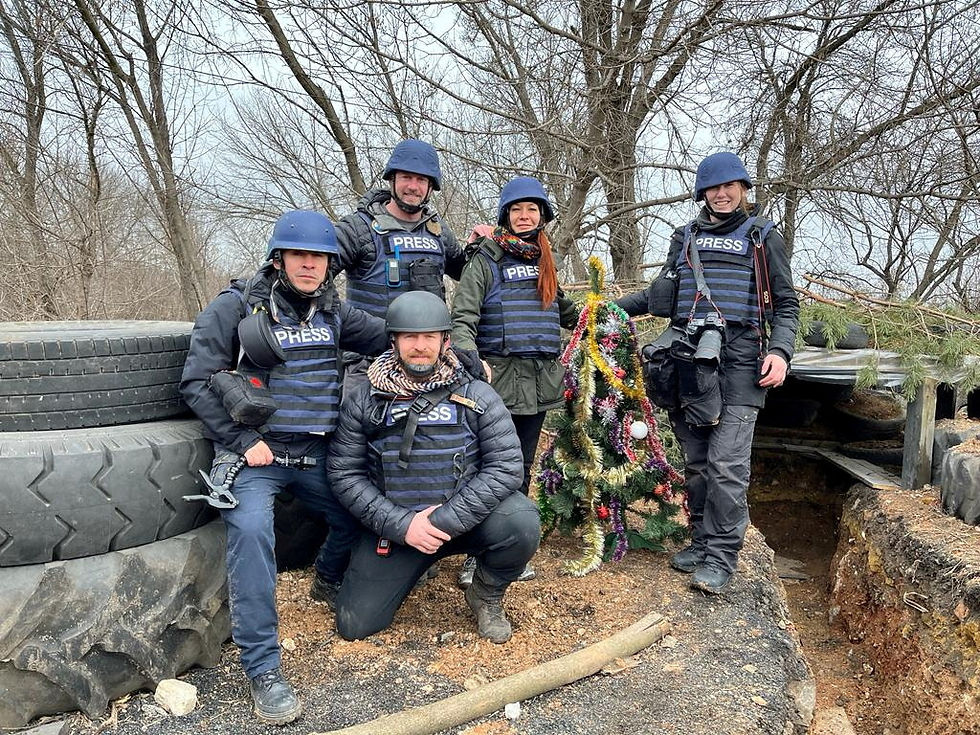 Reuters cameraman Herbert Villarraga, Reuters safety advisor Steve Kelly, Reuters safety advisor Ryan Evans, Reuters producer Asia Shtefan and Reuters photographer Clodagh Kilcoyne on Christmas eve during a news reporting assignment on the front line, in Bakhmut, Ukraine, December 24, 2022. /Clodagh Kilcoyne