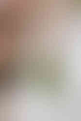 Bride holding a wedding bouquet at Mythe Barn for Kate & Joe