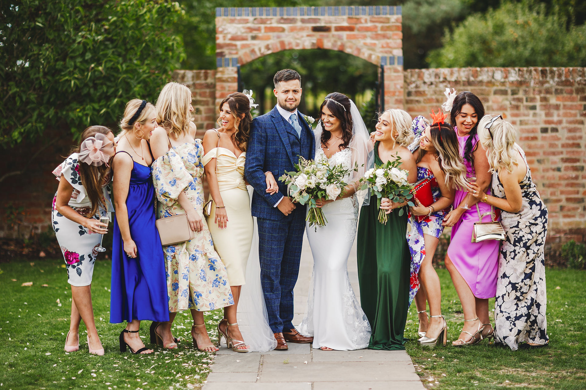 Bride and groom with wedding party laughing together. Jon & Anna's Big Day Lincoln Cathedral