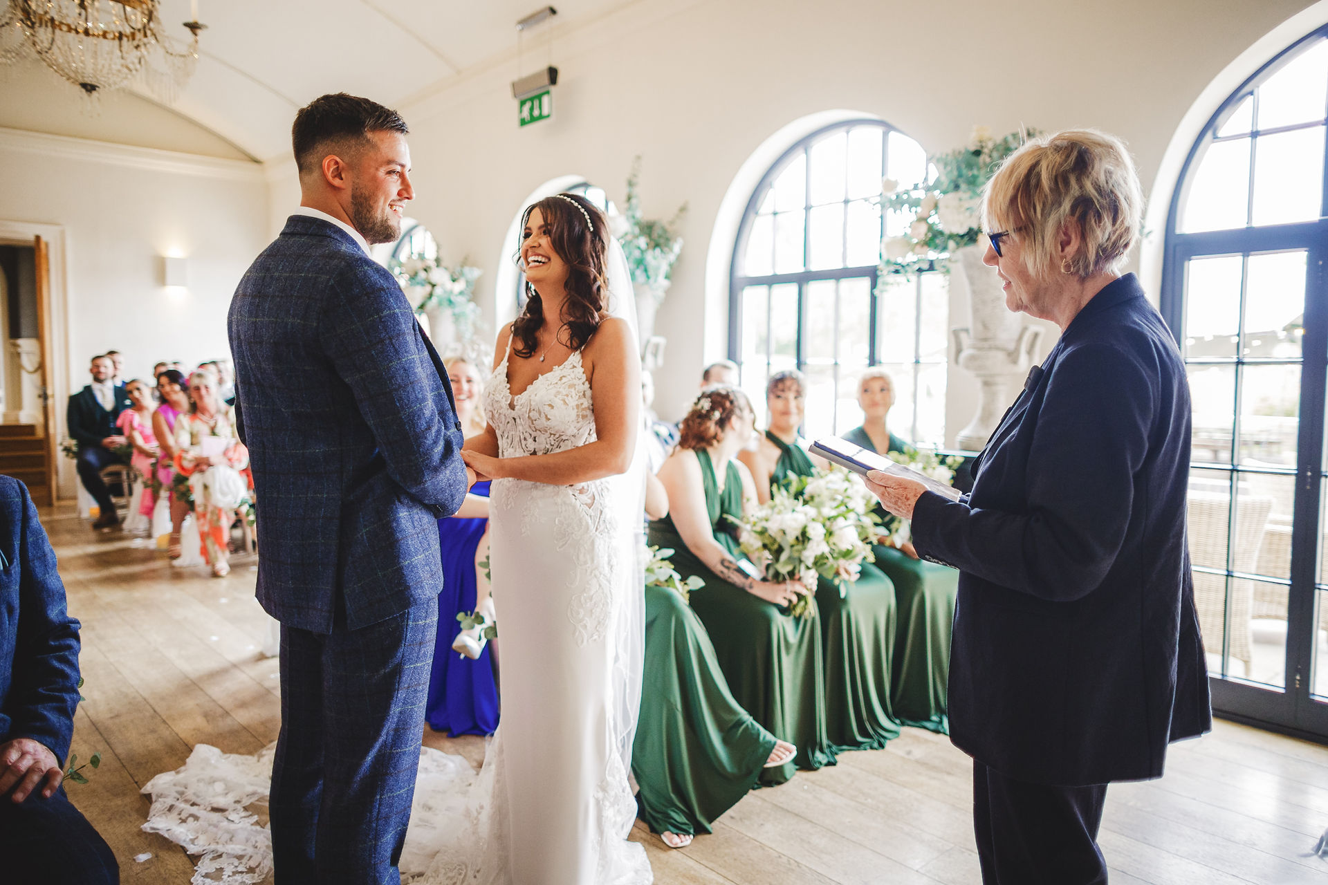 Bride and groom exchange vows during ceremony. Jon & Anna's Big Day Lincoln Cathedral. Craig Hickey Photo.
