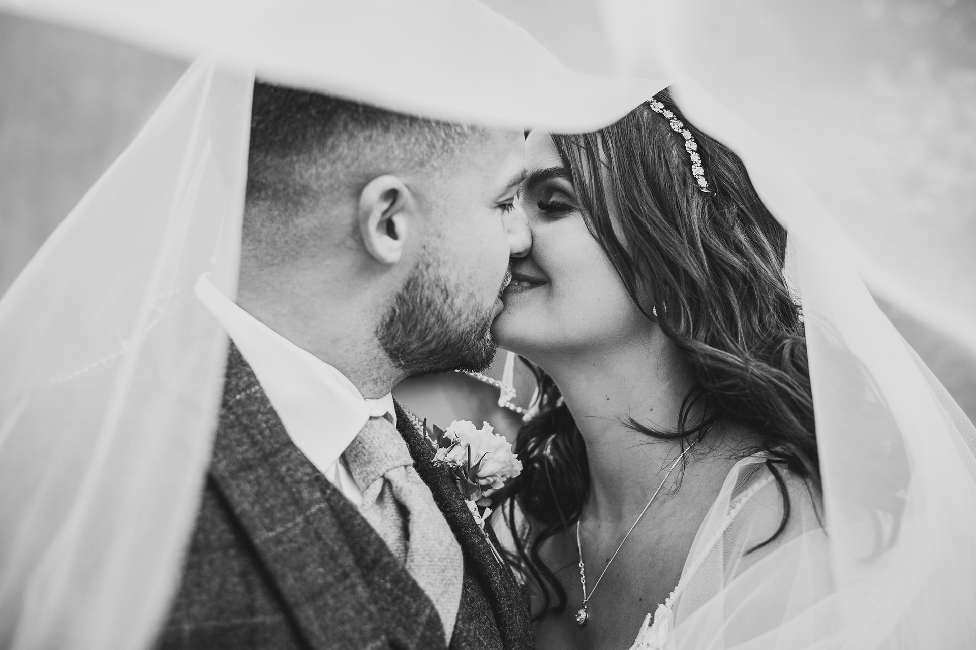 Bride and groom share a kiss under veil, Jon & Anna's Big Day Lincoln Cathedral. Craig Hickey Photo