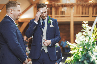 Joe, emotional groom, wiping a tear at Mythe Barn wedding