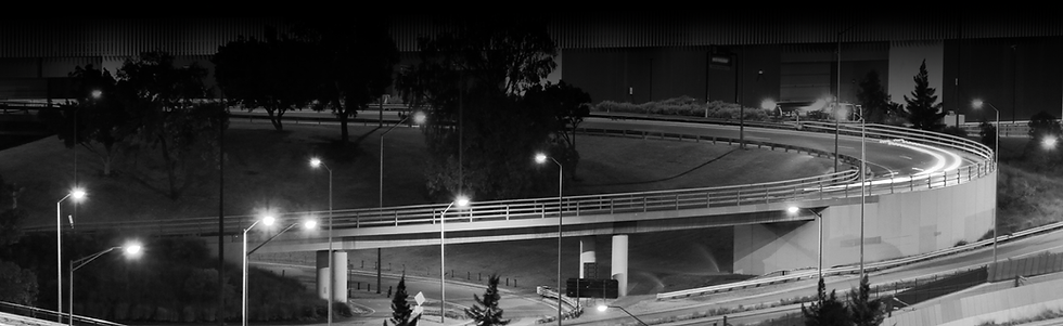 roadway with streetlights on at night