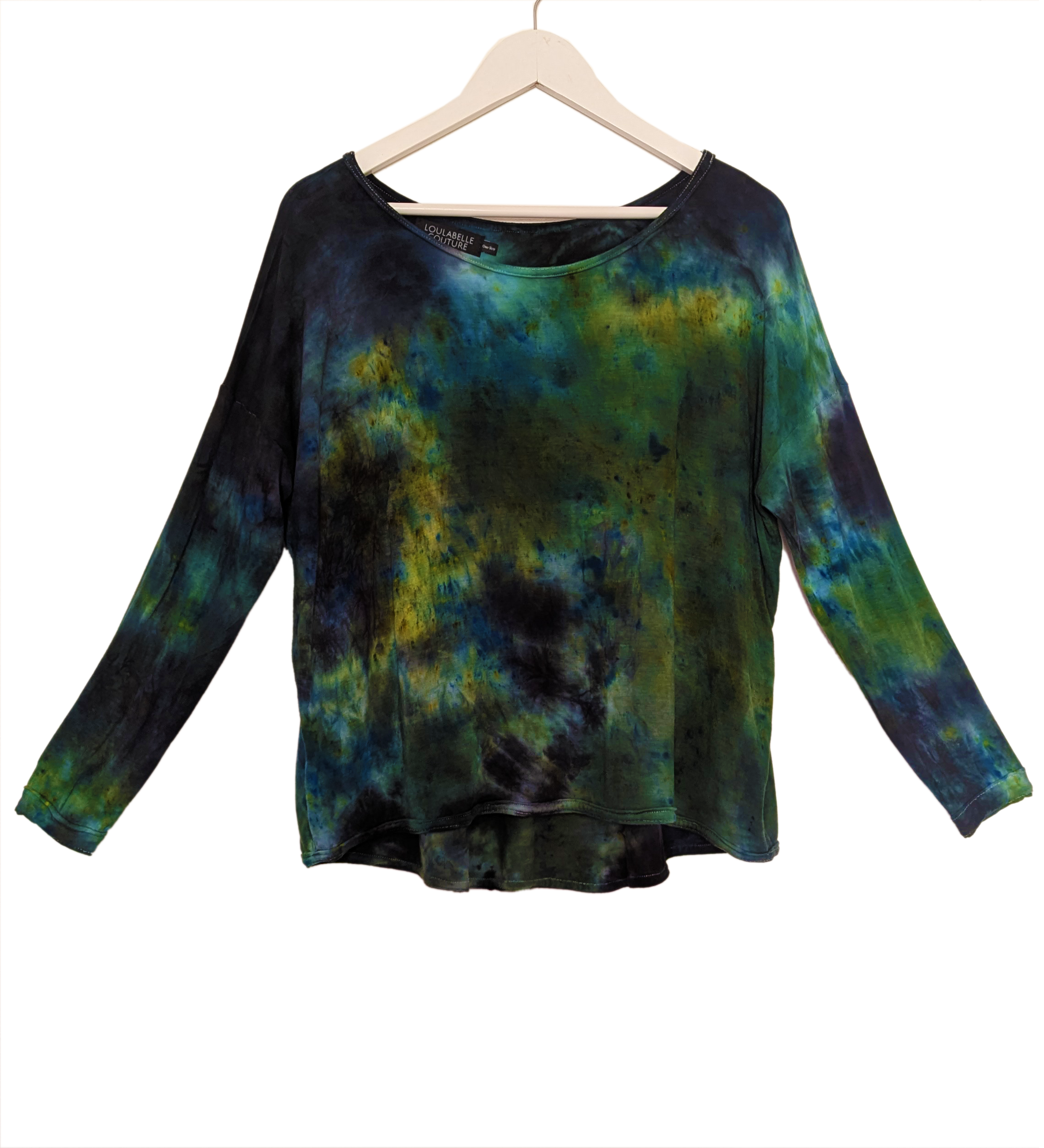 A slouchy viscose jersey long sleeved top in a grunge, dark romantic tie dye pattern of green, blues, yellow and black.