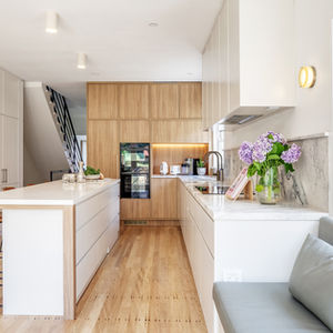 Modern kitchen with oversized island and multitone cabinetry
