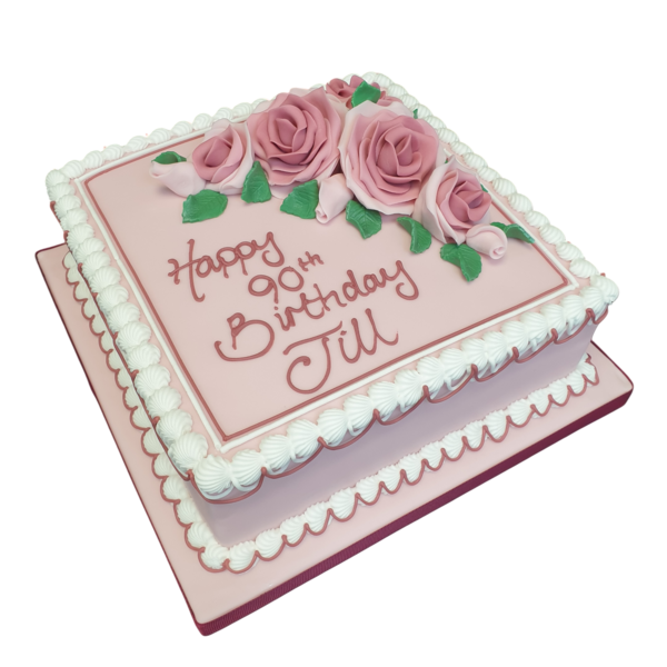 A beautifully decorated 8" square cake topped with delicate roses, perfect for special occasions and celebrations.