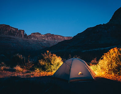 Homeless person in tent at night