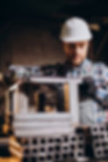 workman-wearing-har-hat-with-measuring-ruler-factory.jpg