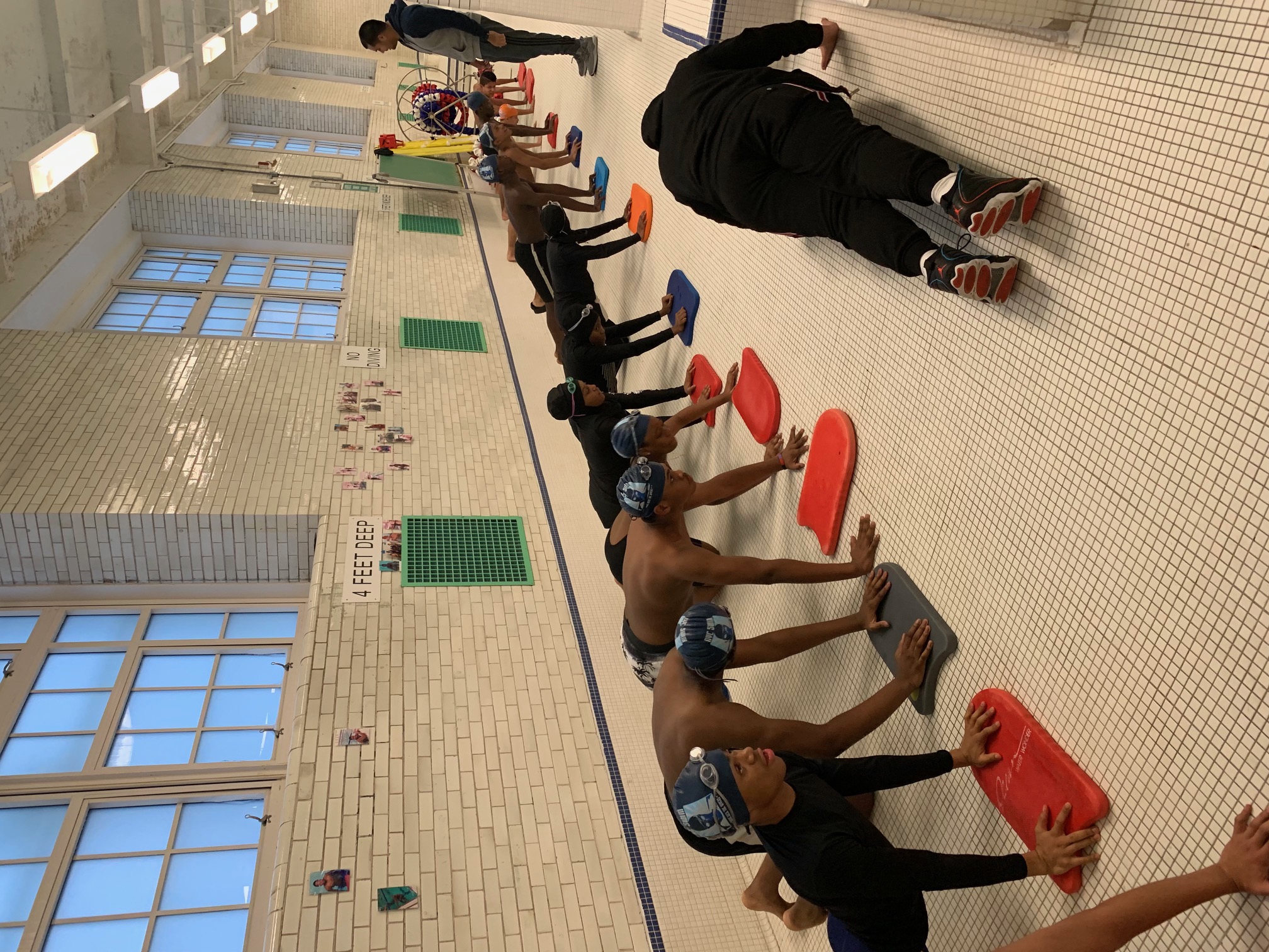 Students exercising before swimming