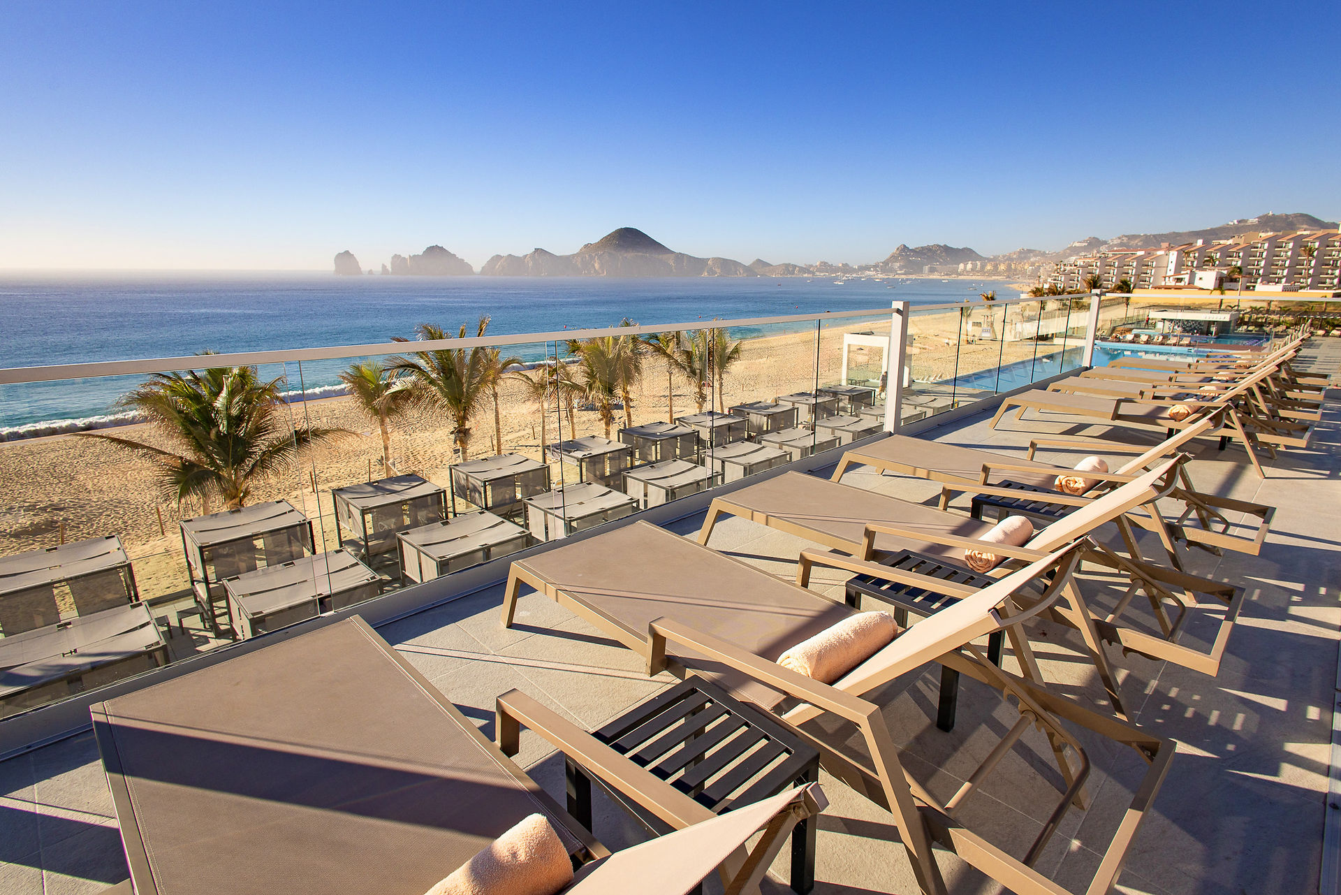 Deck view of ocean with chairs