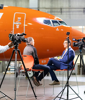 Sun Country Airlines CEO Jude Bricker being interviewed for a news segment