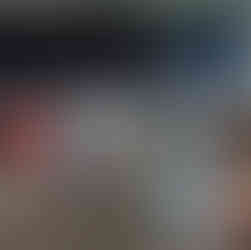 Interns listening to leader presentation at table