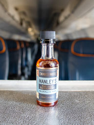 Crooked water old fashioned bottle on Sun Country flight