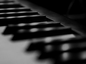 Music producer creating original music scores on a computer at Command Recording Studios.