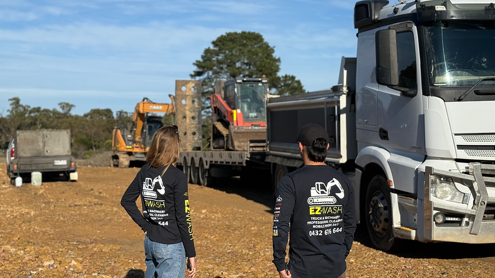 ezwash team inspecting the truck and excavator for a compliance wash