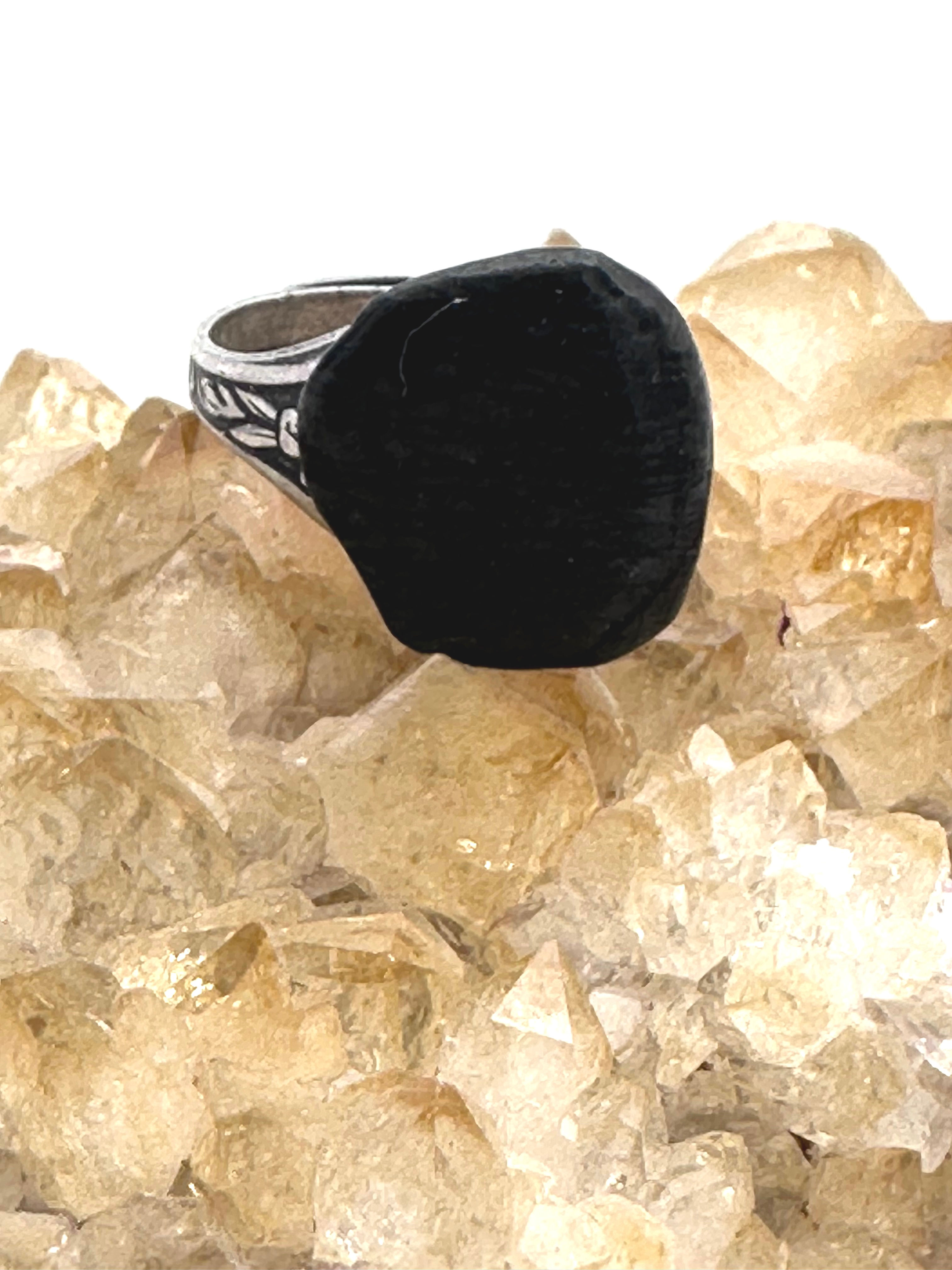 Handcrafted obsidian ring, showcasing the deep, glossy sheen and protective properties of this volcanic gemstone.