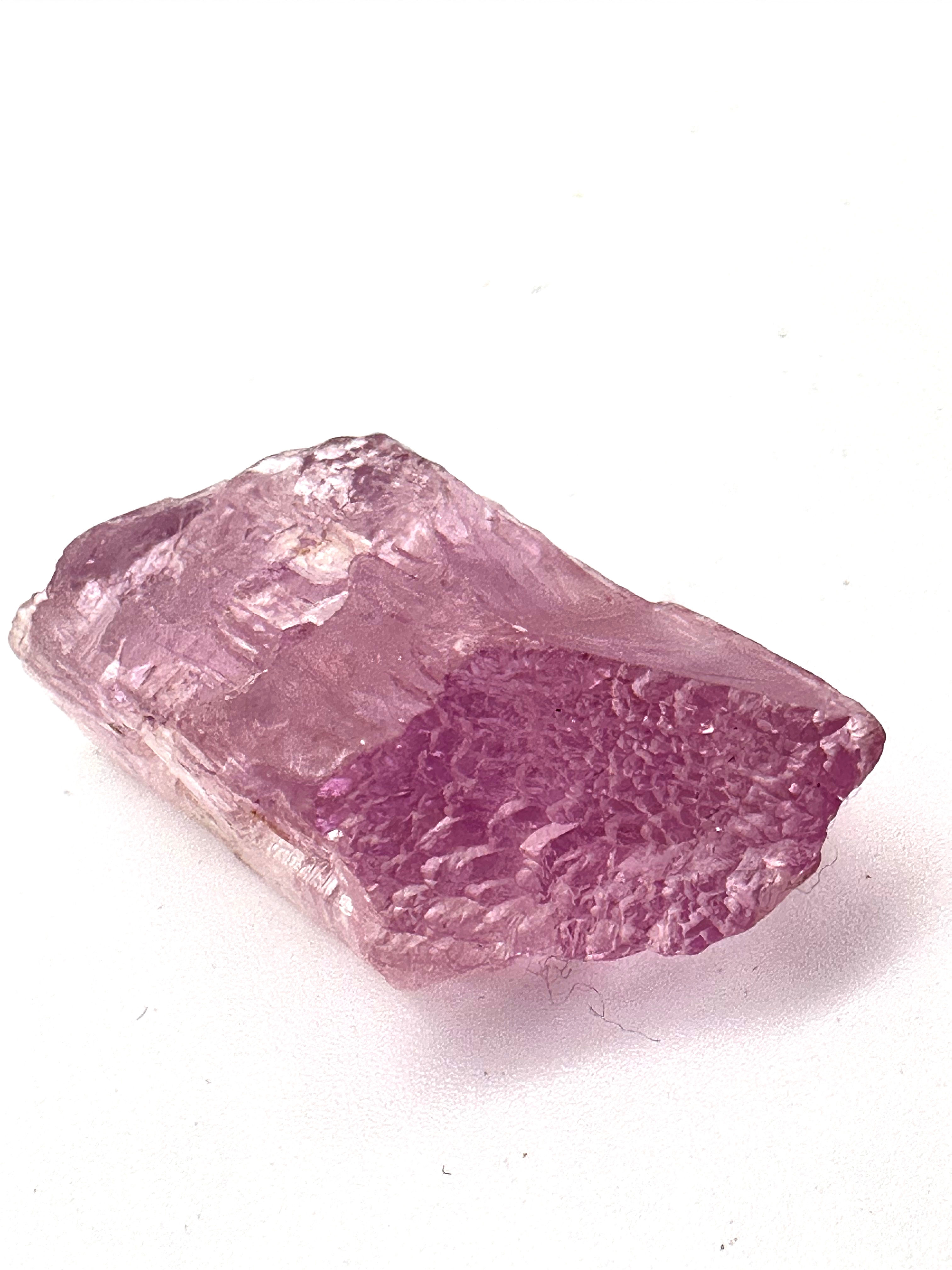 Kunzite Mineral, displaying its soft pink tones and subtle sparkle, evoking feelings of serenity.