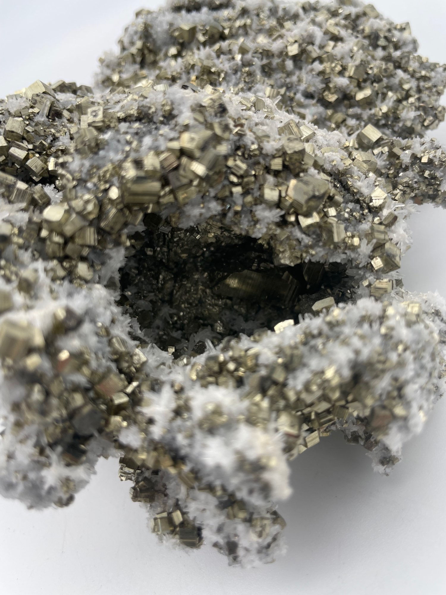 Calcite Quartz Pyrite Cluster: A natural cluster featuring calcite, quartz, and pyrite crystals.
