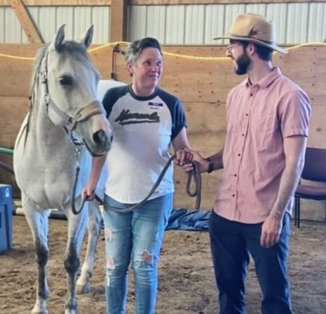 Wholeness with Horses group participant with Horse (Holly) and Therapists (Michael)