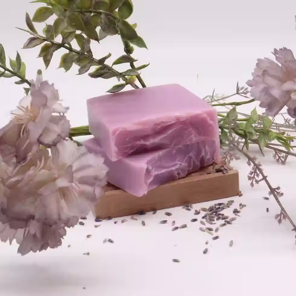 Lavender and coconut soap bars displayed with lavender flowers