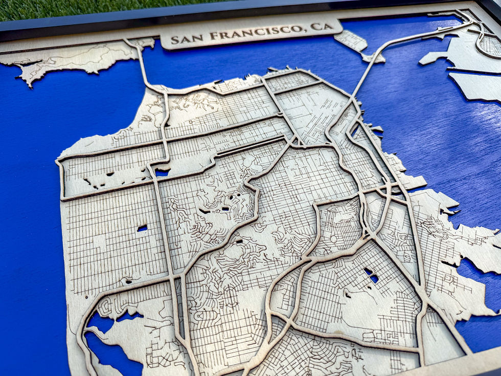 Angled close-up showing the layered construction and engraved details of the San Francisco 3D wood map.