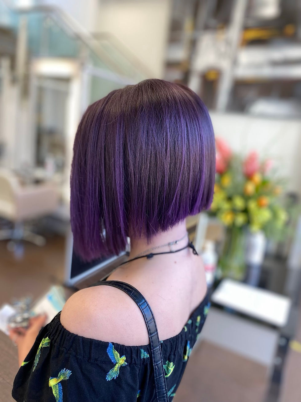 Short purple bob haircut styled by Aaron