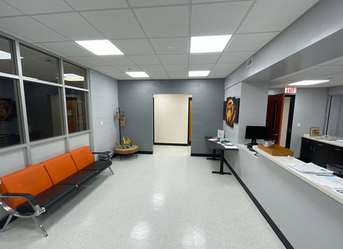 Entry waiting area with orange waiting bench