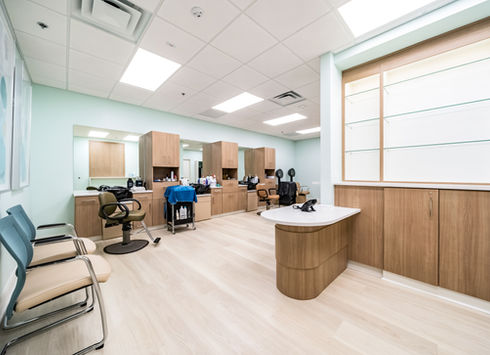 Modern salon with styling stations and waiting area