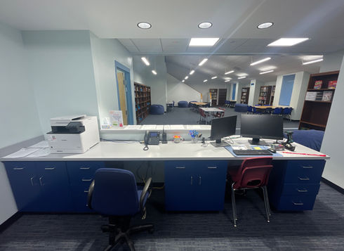 School library circulation desk overlooking reading area