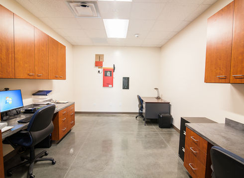 Workroom with desks and storage cabinets