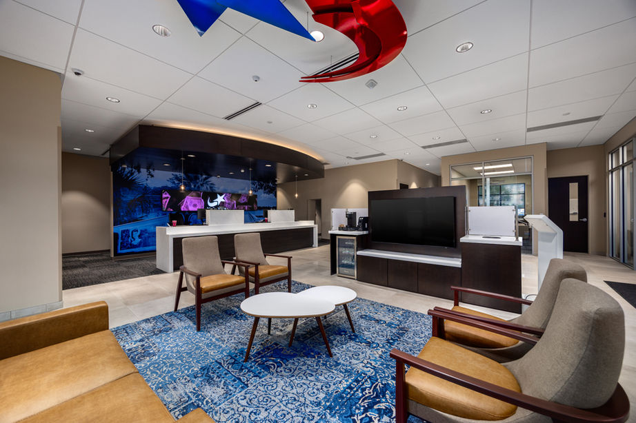 Lobby with seating with modern bank teller counter in the background