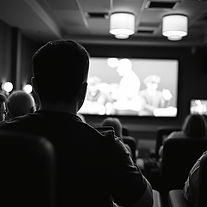 black and white photo of someone watching a movie.jpg