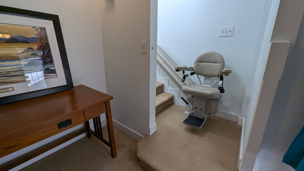Stairs and stairlift to second floor
