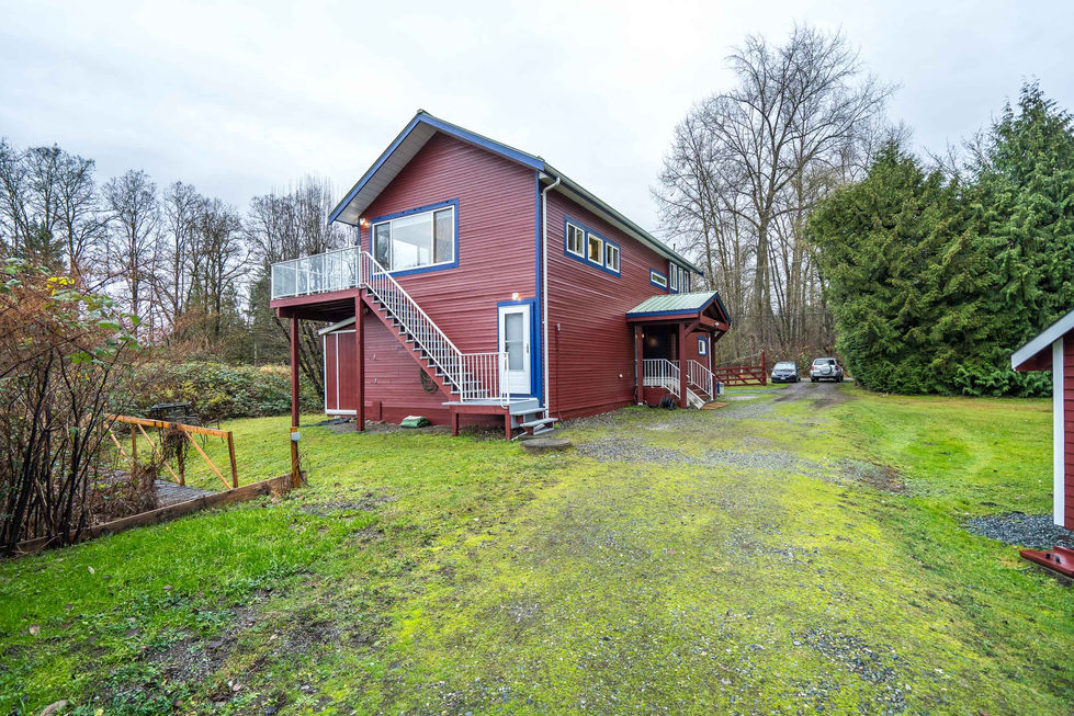 West side of house, with additional parking area
