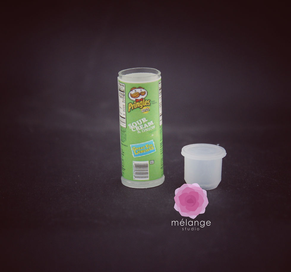 Thumbnail: Miniature resin Pringles cans in orange, green and red variants for dollhouse and diorama displays