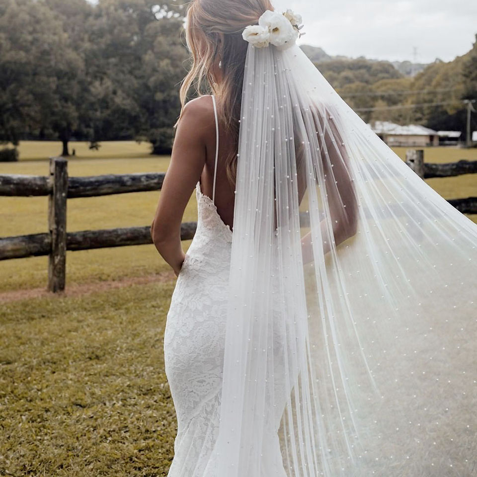 Wedding veils and bridal accessories including pearl veils and bridal capes at Forever and Veil Bridal Boutique