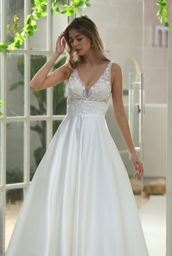 Elegant bridal gown with supportive lace straps, flowing silk skirt, and back buttons.