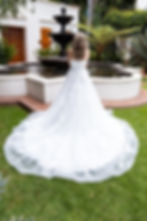 Thumbnail: Strapless lace wedding dress with layered tulle skirt, floral appliqué, and romantic sweeping train.